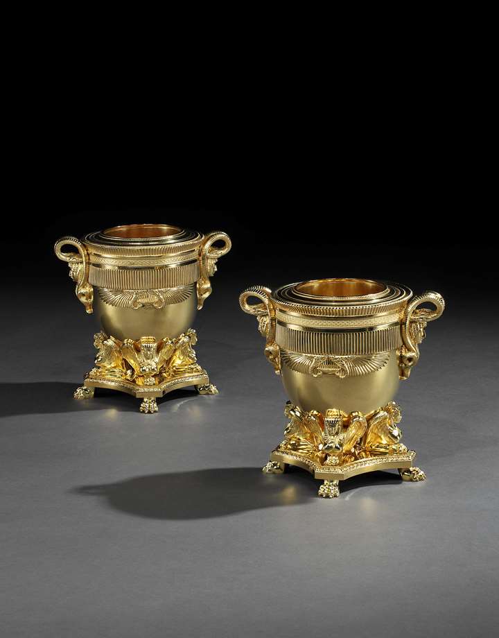 A pair of George III gilt bronze wine coolers